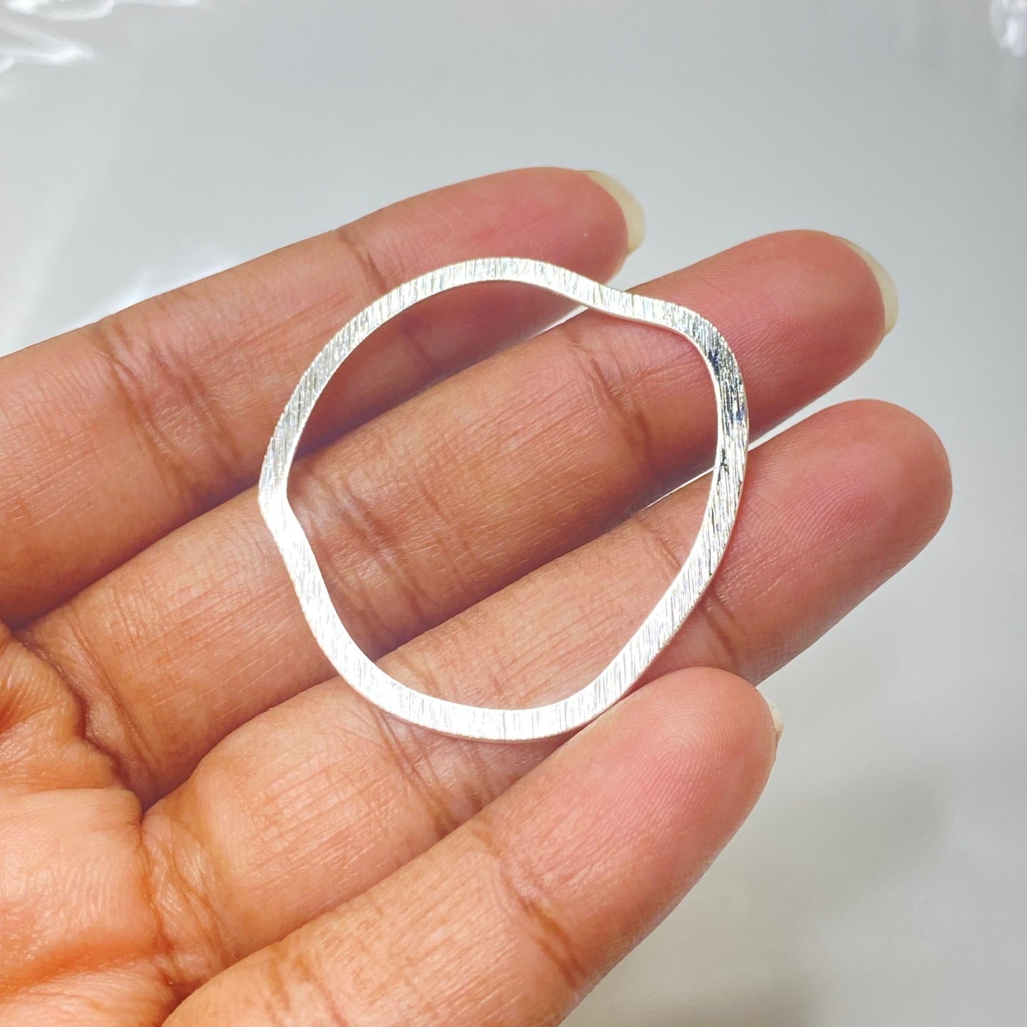 SS 275 Textured round shape silver plated charm