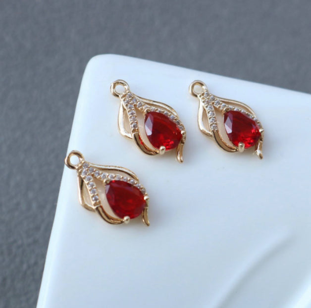 SS 428 RED ZIRCON CRYSTAL PENDENT GOLD PLATED