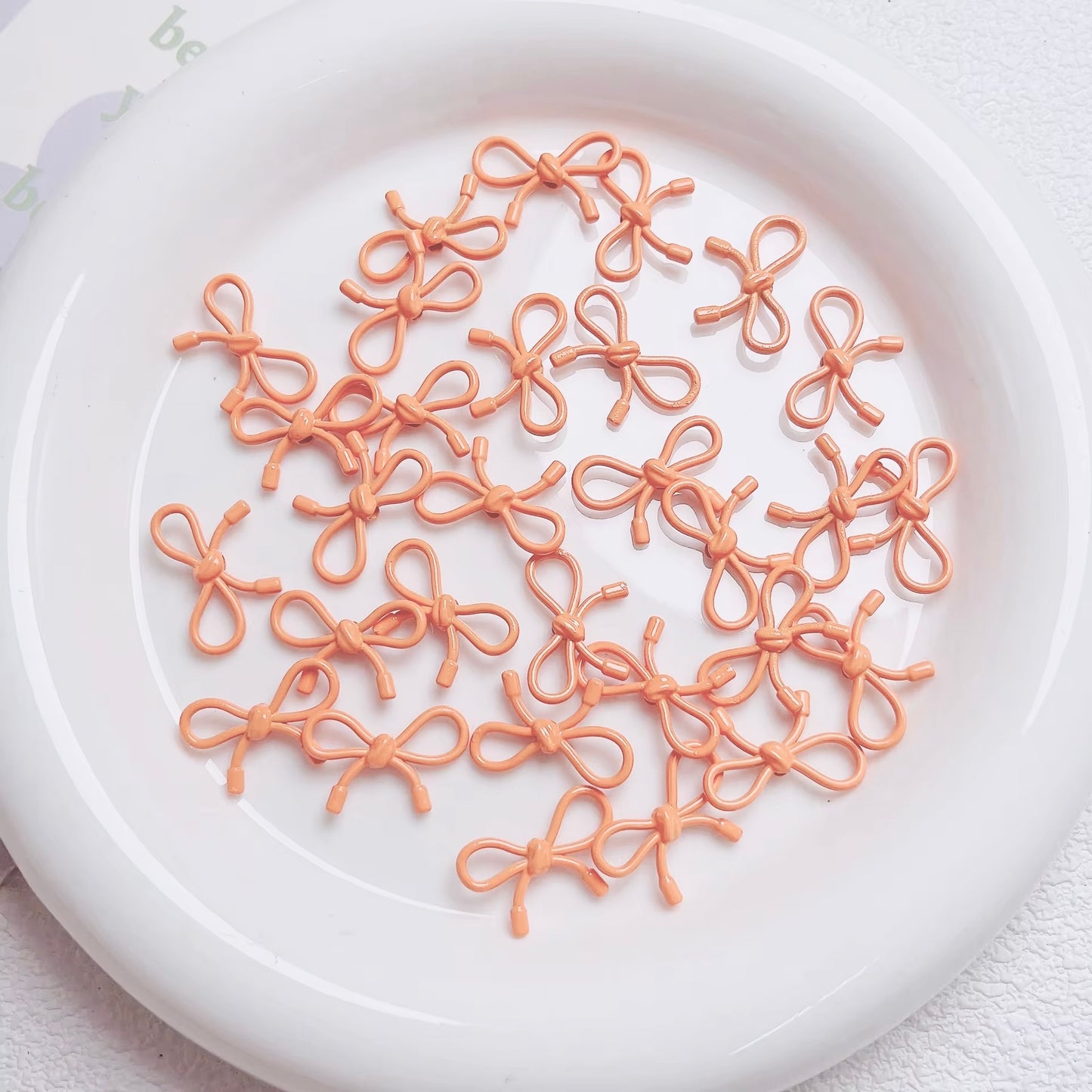 BBB 046 ( I ) light orange Butterfly knot vertical hole bead ( 1 pc )