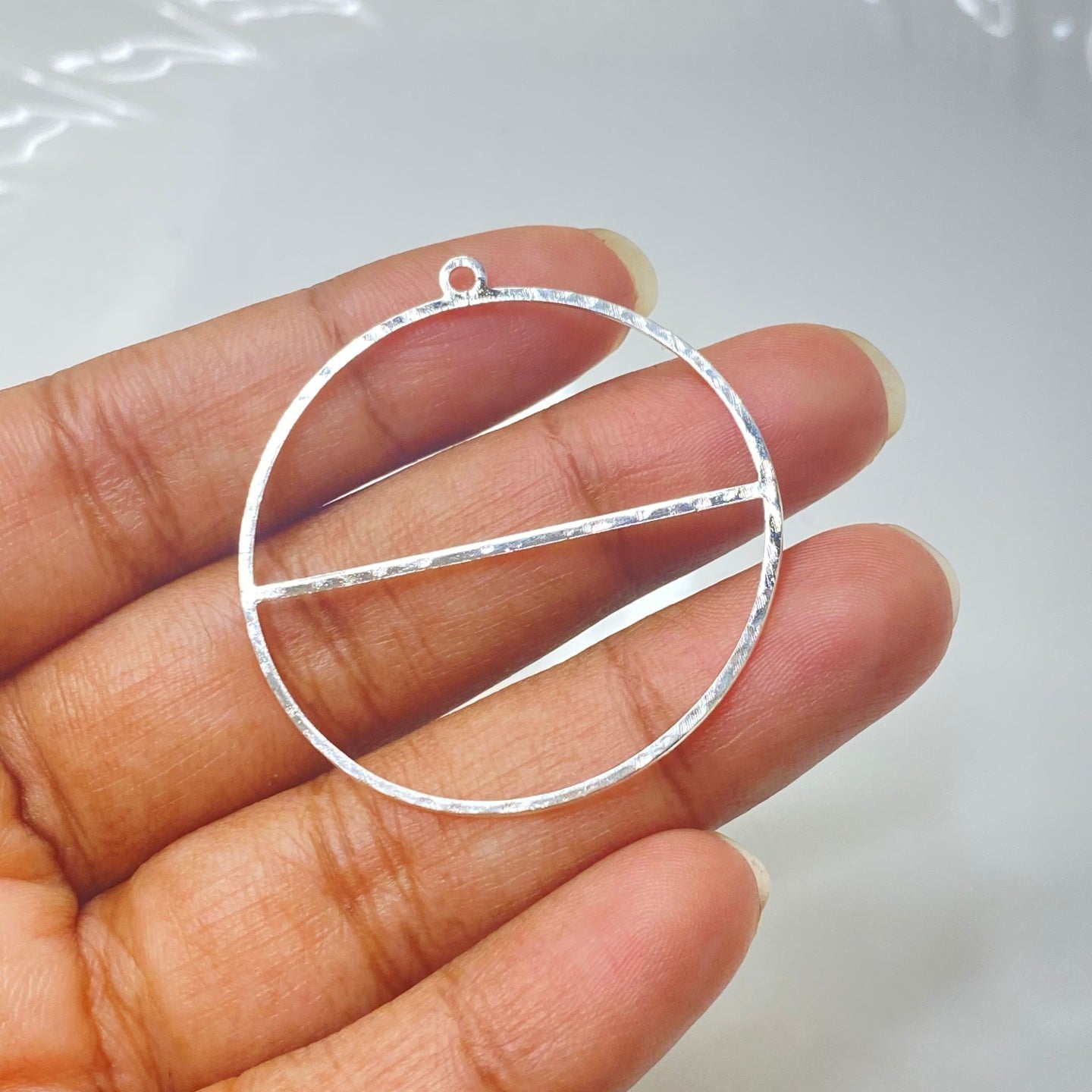SS 273 hammered round silver plated charm
