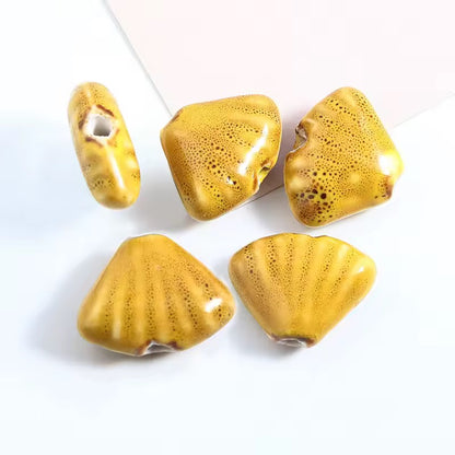 BBB 216 (f) Mustard Yellow Fan Shell Porcelian Ceramic bead ( 1 pc ) High Shine ( 18:23 mm )