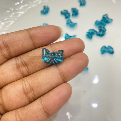 GB 908 sea blue bow glass beads - per piece