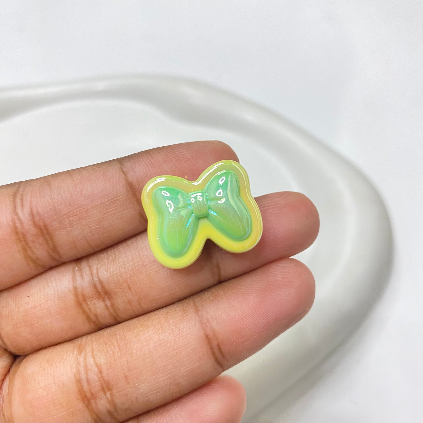AC 1481 Bow uv plated shiny irrediscent Acrylic bead- per piece